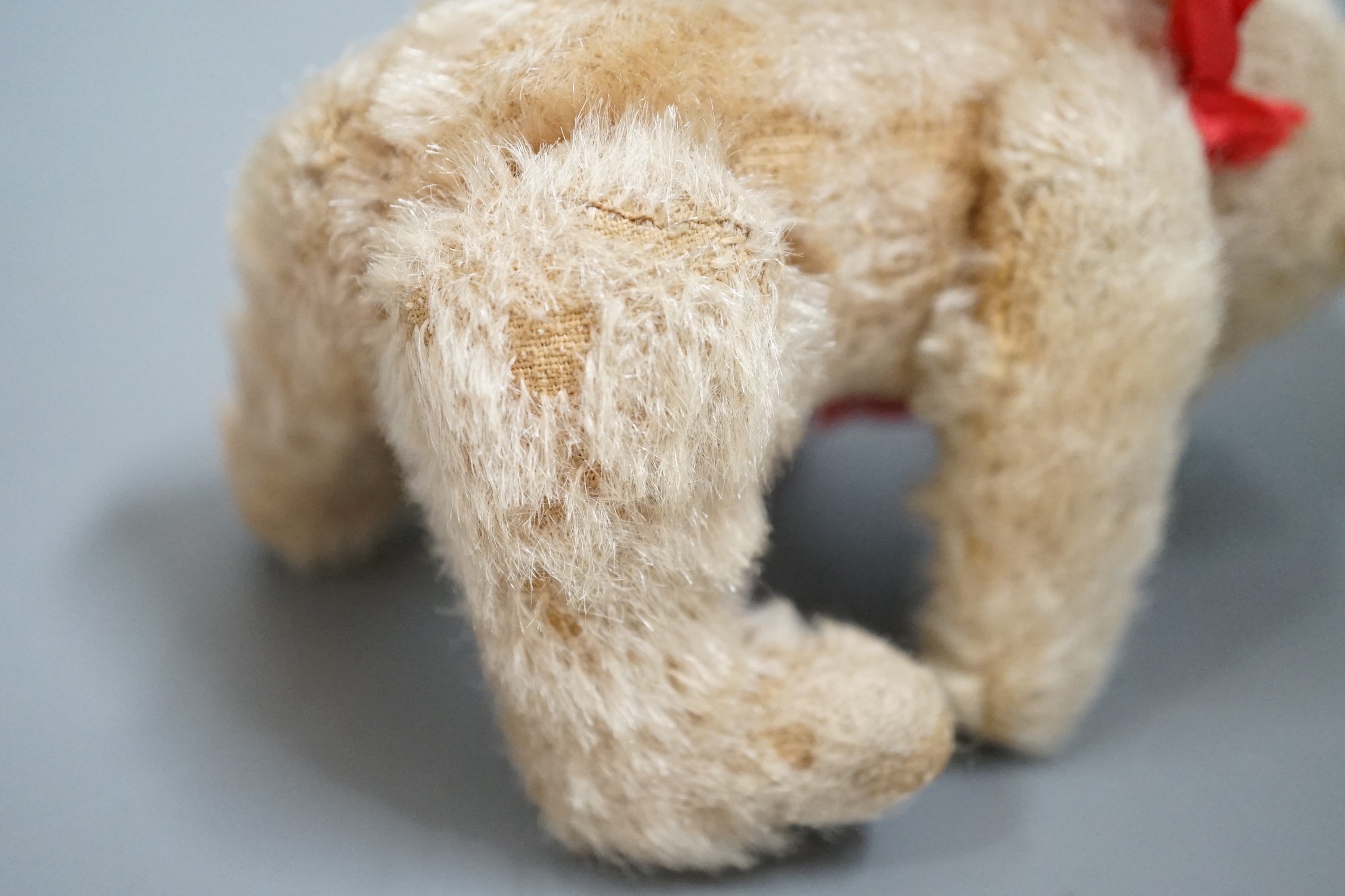 A small Steiff bear, with button in ear, c.1920, 14cm high